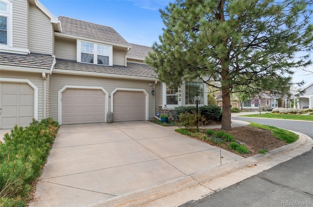 2032 W Nantucket Ct, Littleton, CO 80120 - view of property featuring concrete driveway and an attached garage