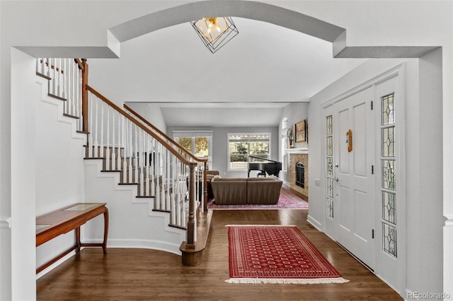 2032 W Nantucket Ct, Littleton, CO 80120 - entryway with stairway, wood finished floors, a fireplace, and baseboards
