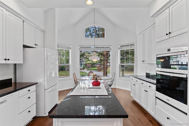 2032 W Nantucket Ct, Littleton, CO 80120 - kitchen with white appliances, a kitchen island, white cabinets, dark wood finished floors, and high vaulted ceiling