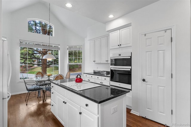 2032 W Nantucket Ct, Littleton, CO 80120 - kitchen featuring white appliances, white cabinets, a kitchen island, dark wood-type flooring, and pendant lighting