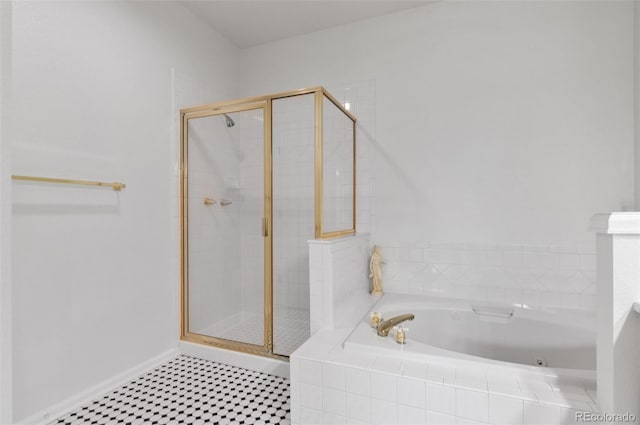 2032 W Nantucket Ct, Littleton, CO 80120 - bathroom featuring a shower stall, a bath, and baseboards