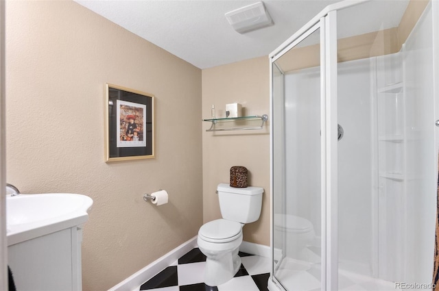 2032 W Nantucket Ct, Littleton, CO 80120 - full bath with toilet, a stall shower, vanity, tile patterned floors, and baseboards