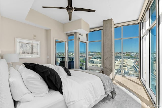 1700 Bassett St Unit 1014, Denver, CO 80202 - bedroom featuring access to outside, a city view, a ceiling fan, and wood finished floors