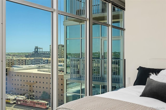 1700 Bassett St Unit 1014, Denver, CO 80202 - bedroom featuring floor to ceiling windows and a city view