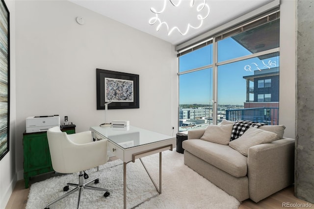 1700 Bassett St Unit 1014, Denver, CO 80202 - office with a wall of windows, wood finished floors, and a chandelier