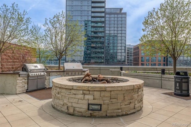 1700 Bassett St Unit 1014, Denver, CO 80202 - view of patio / terrace with exterior kitchen and an outdoor fire pit