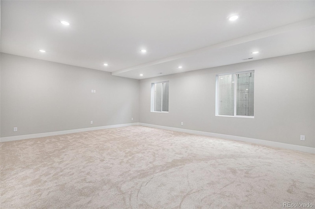 carpeted spare room with recessed lighting and baseboards