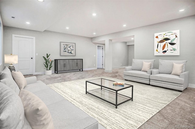 carpeted living room with recessed lighting and baseboards