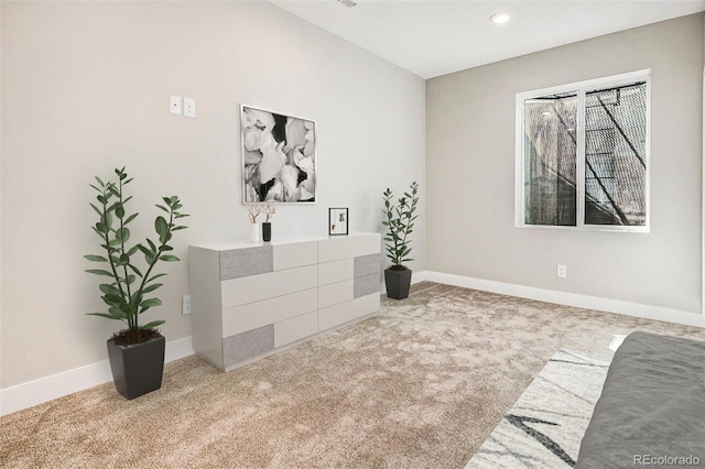 interior space with baseboards and recessed lighting