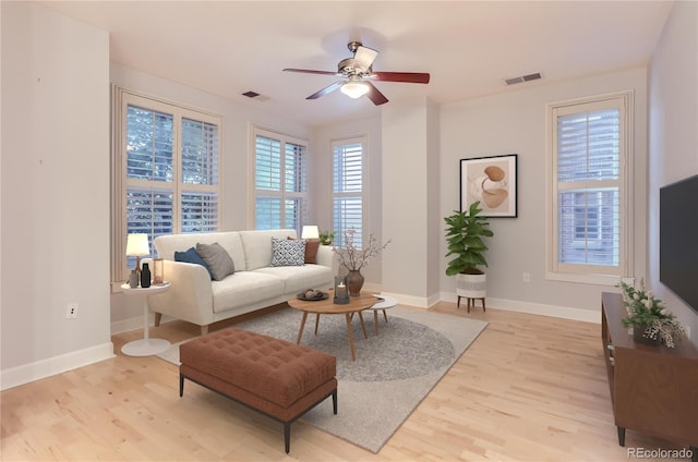 1630 N Clarkson St Unit 204, Denver, CO 80218 - living area featuring light wood-style floors and ceiling fan