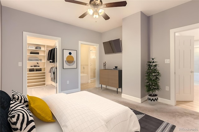 1630 N Clarkson St Unit 204, Denver, CO 80218 - bedroom with light carpet, a walk in closet, ensuite bath, and ceiling fan