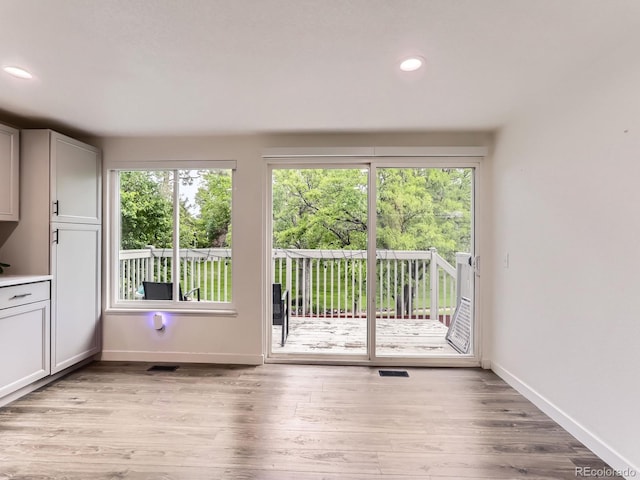 6378 S Emporia Cir, Englewood, CO 80111 - doorway featuring plenty of natural light, baseboards, light wood-style floors, and recessed lighting