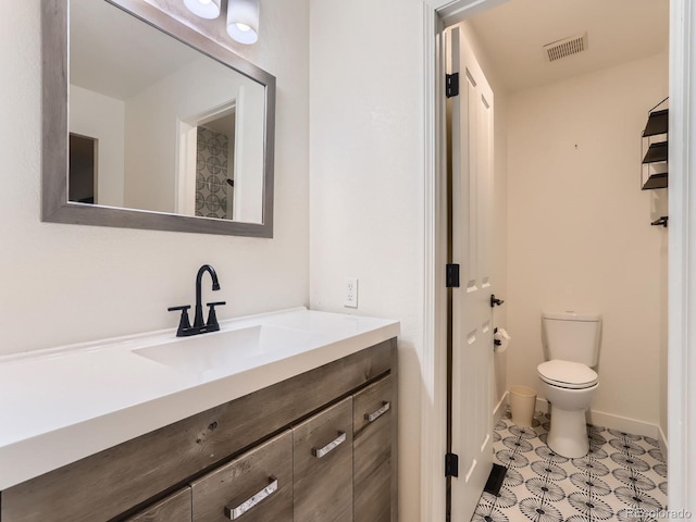 6378 S Emporia Cir, Englewood, CO 80111 - bathroom featuring vanity, toilet, and baseboards
