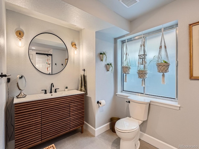 19098 E Ida Dr, Aurora, CO 80015 - full bathroom featuring baseboards, vanity, and toilet