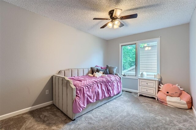 19098 E Ida Dr, Aurora, CO 80015 - bedroom featuring carpet floors, a textured ceiling, baseboards, and a ceiling fan