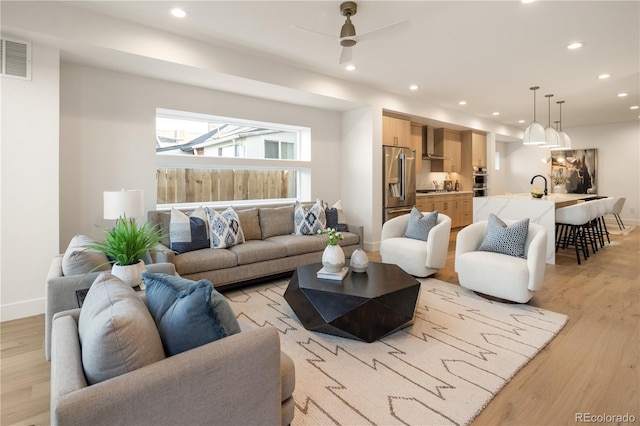 2060 Eliot St, Denver, CO 80211 - living area featuring light wood-style flooring, recessed lighting, and ceiling fan