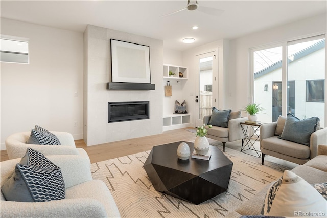 2060 Eliot St, Denver, CO 80211 - living area featuring light wood-type flooring, plenty of natural light, a ceiling fan, a large fireplace, and recessed lighting