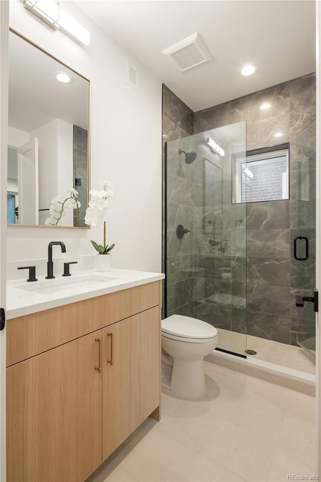 2060 Eliot St, Denver, CO 80211 - bathroom featuring vanity, a stall shower, and recessed lighting