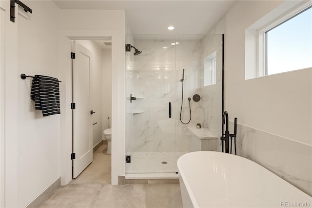 2060 Eliot St, Denver, CO 80211 - full bath featuring a soaking tub, a marble finish shower, and recessed lighting