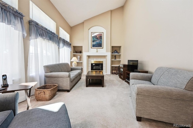 13362 Marion St, Thornton, CO 80241 - living area featuring high vaulted ceiling, carpet floors, and a tile fireplace
