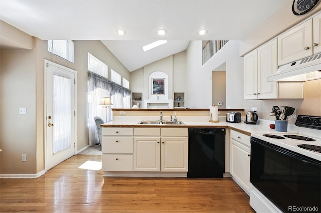 13362 Marion St, Thornton, CO 80241 - kitchen featuring dishwasher, electric stove, under cabinet range hood, a peninsula, and vaulted ceiling