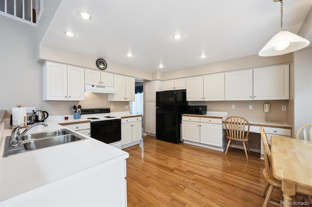 13362 Marion St, Thornton, CO 80241 - kitchen featuring electric range oven, freestanding refrigerator, under cabinet range hood, light countertops, and white cabinetry