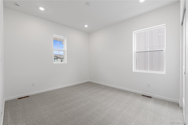 8863 Springsong Ln, Littleton, CO 80125 - empty room featuring light colored carpet, recessed lighting, and a smoke detector
