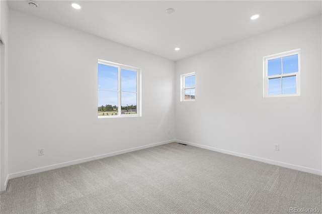8863 Springsong Ln, Littleton, CO 80125 - spare room with light colored carpet and recessed lighting
