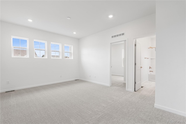 8863 Springsong Ln, Littleton, CO 80125 - unfurnished bedroom with light carpet, recessed lighting, and ensuite bath