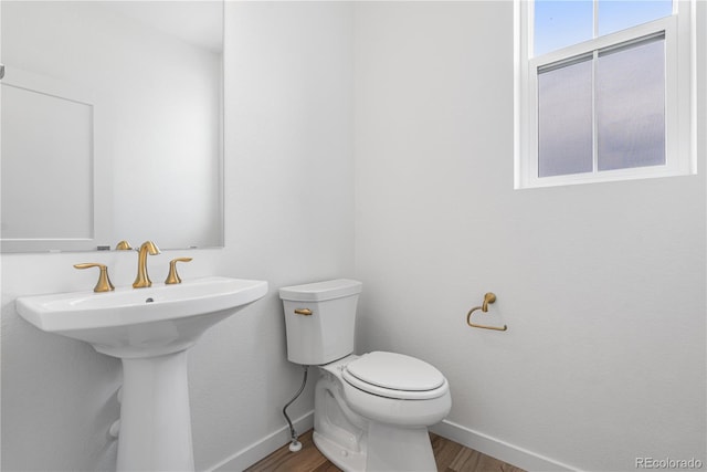 8863 Springsong Ln, Littleton, CO 80125 - half bath with baseboards and wood finished floors