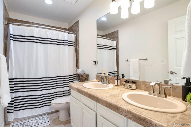 bathroom with toilet, tile patterned flooring, vanity, and a shower with curtain