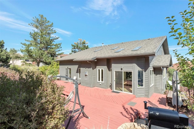 back of house with a wooden deck