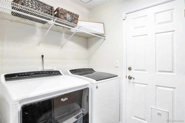 clothes washing area featuring washing machine and dryer