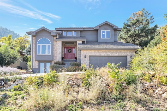 view of front of property with a garage