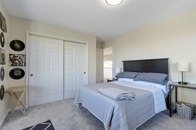 carpeted bedroom featuring a closet