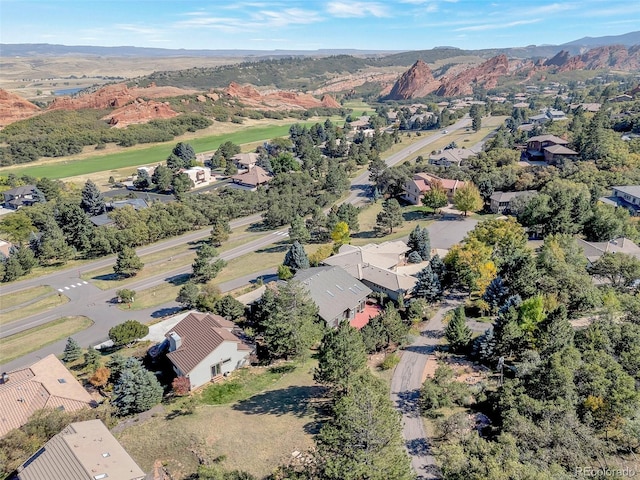 birds eye view of property with a mountain view