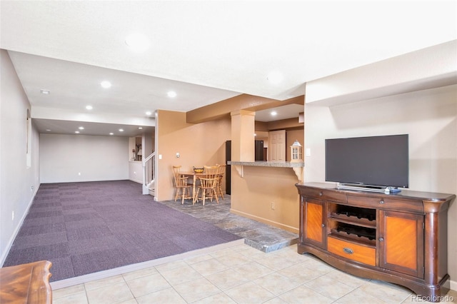 carpeted living room featuring bar