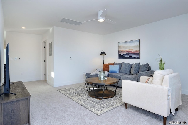 carpeted living room featuring ceiling fan