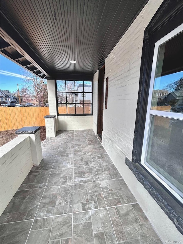 view of patio / terrace featuring fence