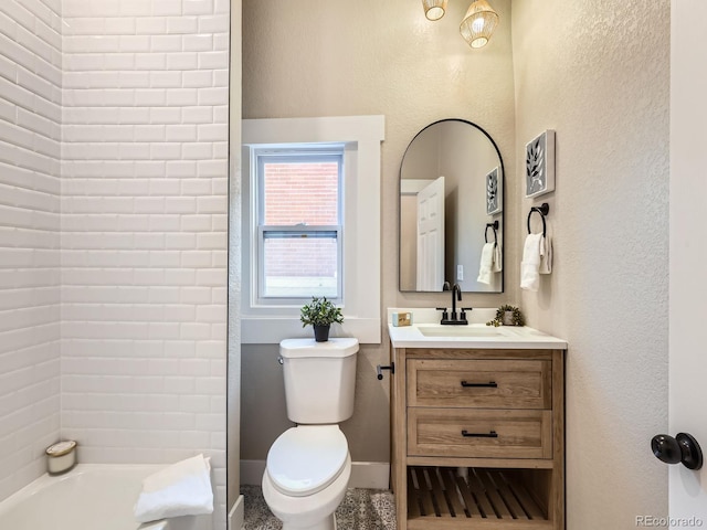 full bath with toilet, a washtub, vanity, and baseboards