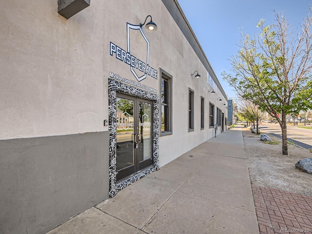 exterior space featuring french doors and stucco siding