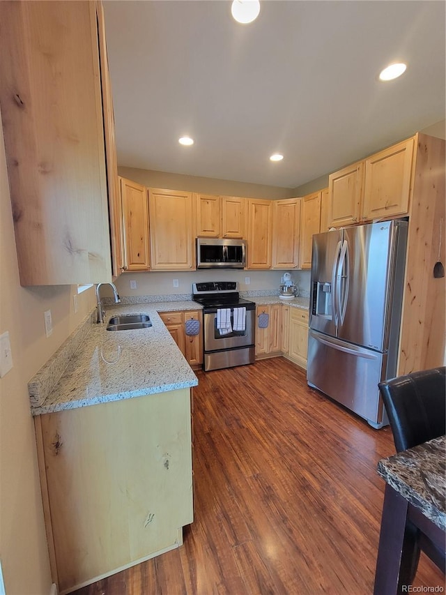1431 4th Pl, Deer Trail, CO 80105 - kitchen with stainless steel appliances, a sink, light brown cabinets, light stone counters, and recessed lighting