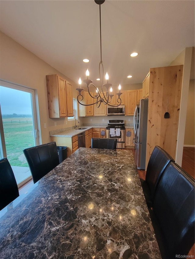 1431 4th Pl, Deer Trail, CO 80105 - kitchen featuring appliances with stainless steel finishes, a sink, light brown cabinetry, a chandelier, and recessed lighting