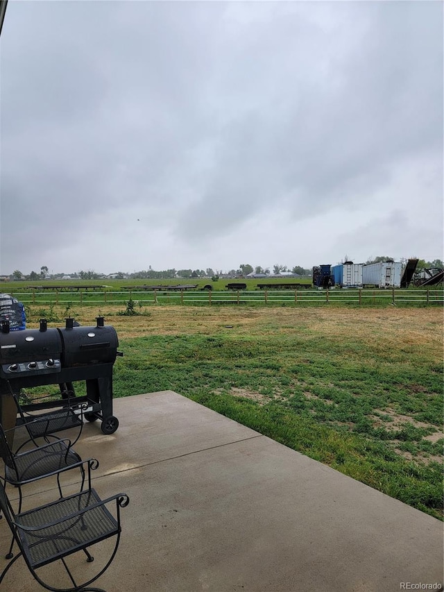 1431 4th Pl, Deer Trail, CO 80105 - view of patio with a rural view and grilling area