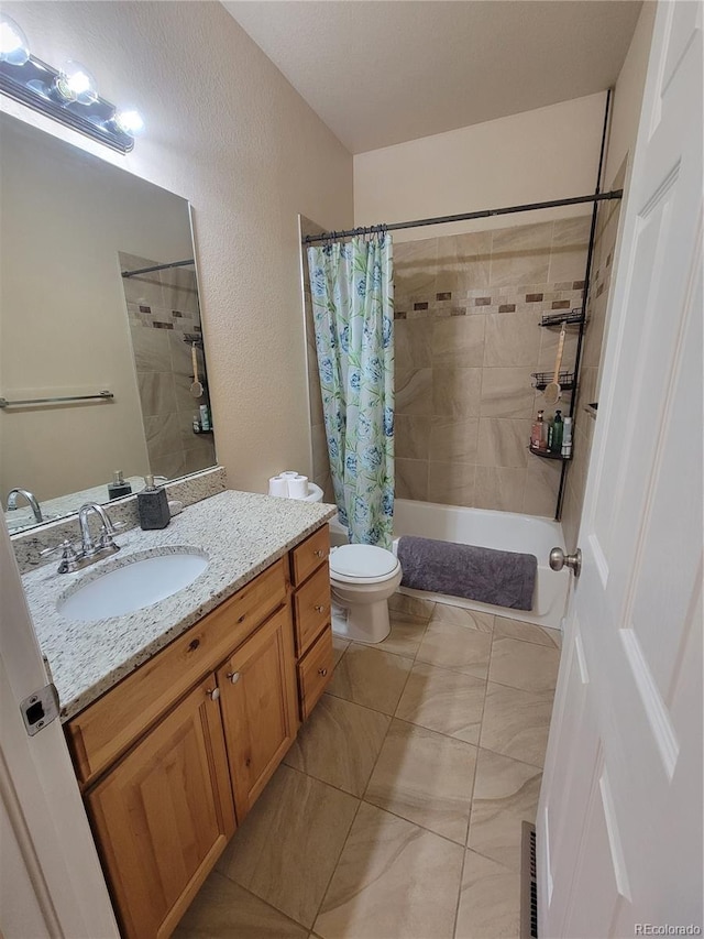 1431 4th Pl, Deer Trail, CO 80105 - bathroom featuring toilet, vanity, shower / bath combo, and tile patterned flooring