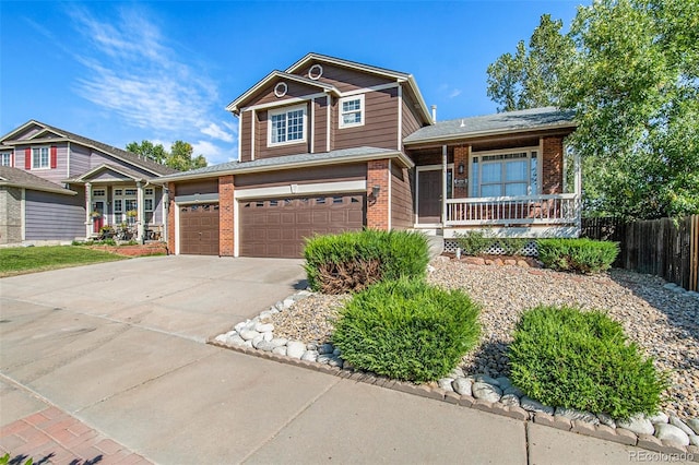 view of front of property with a porch and a garage