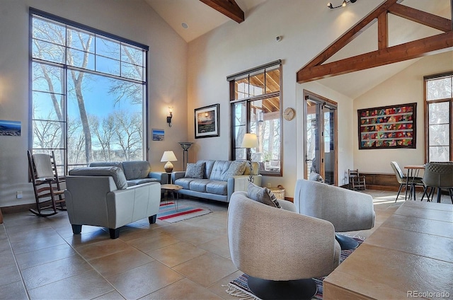 1100 Pinon Dr, Poncha Springs, CO 81242 - tiled living room with high vaulted ceiling, baseboards, and beam ceiling