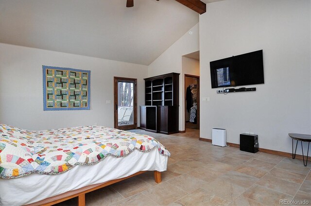 1100 Pinon Dr, Poncha Springs, CO 81242 - bedroom with access to outside, baseboards, a spacious closet, beam ceiling, and high vaulted ceiling