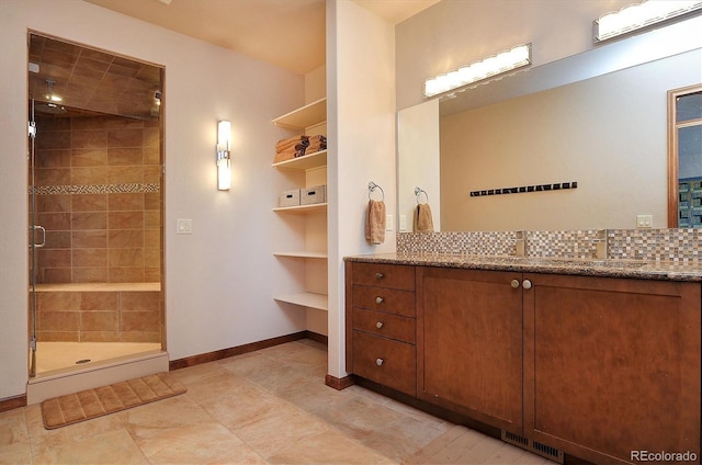 1100 Pinon Dr, Poncha Springs, CO 81242 - full bath featuring visible vents, baseboards, a shower stall, and vanity