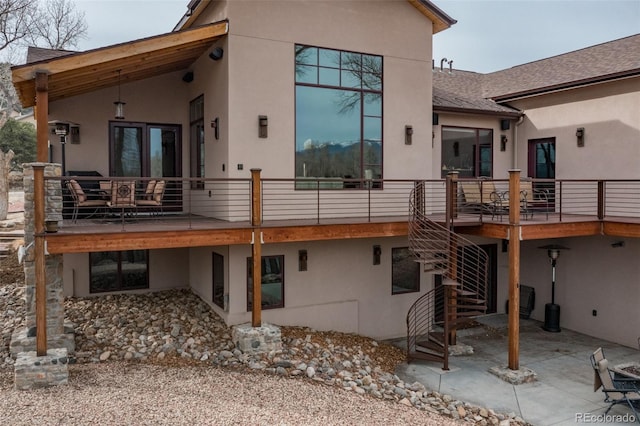 1100 Pinon Dr, Poncha Springs, CO 81242 - rear view of house with a patio, stucco siding, a deck, and stairway
